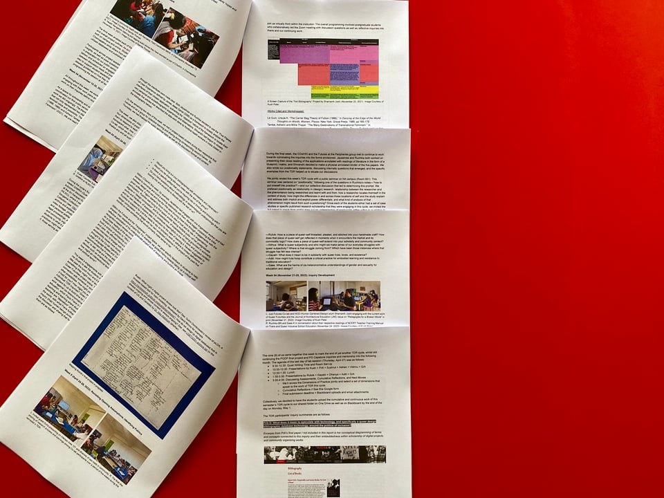 ID: A set of four A4 reports opened and layered on top of one another against a red background to offer a glimpse of its contents connected to transdisciplinary research in postgraduate studies at The Just Futures Co-lab.