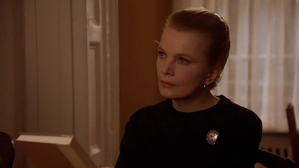 Still from the movie ANOTHER WOMAN, showing Gena Rowlands putting down a book and looking into the distance