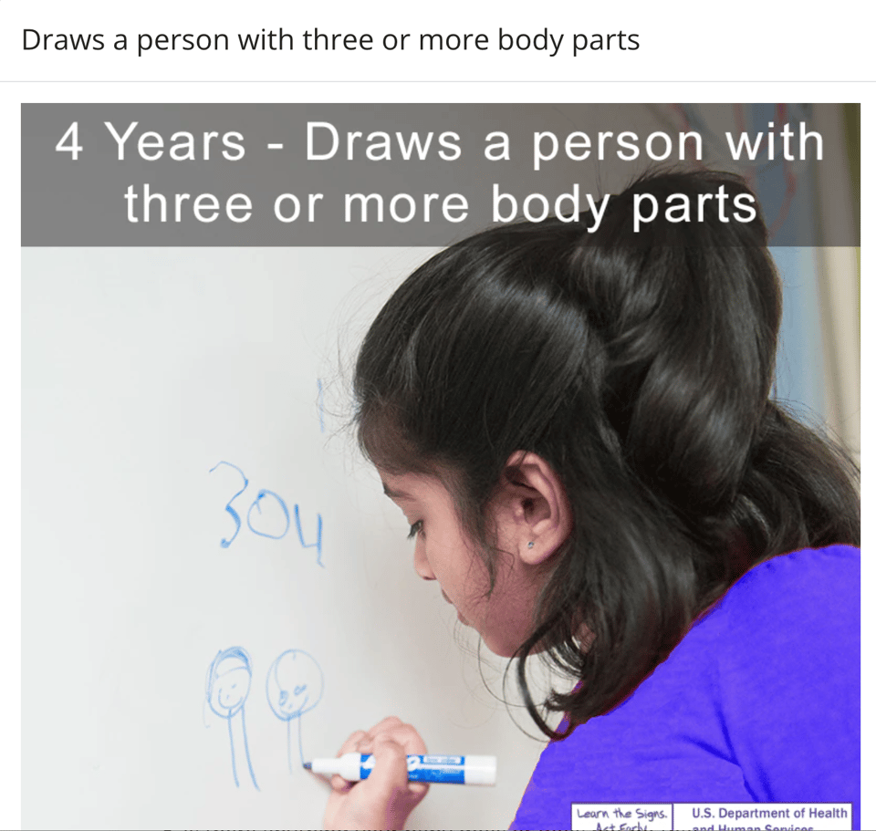 an image of a young person drawing people figures with a circle head and two legs with a marker on a white board