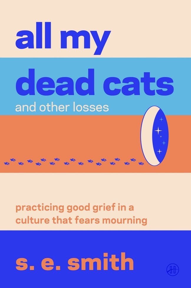 The cover of All My Dead Cats and Other Losses, which features an illustration of paw prints leading to a starry portal in an orange, blue, and light orange color scheme.