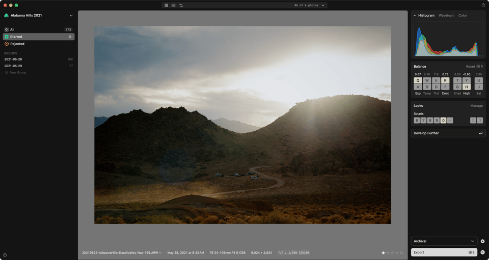 A photo of the desert and dramatic light and skies shown in the app against mid gray.