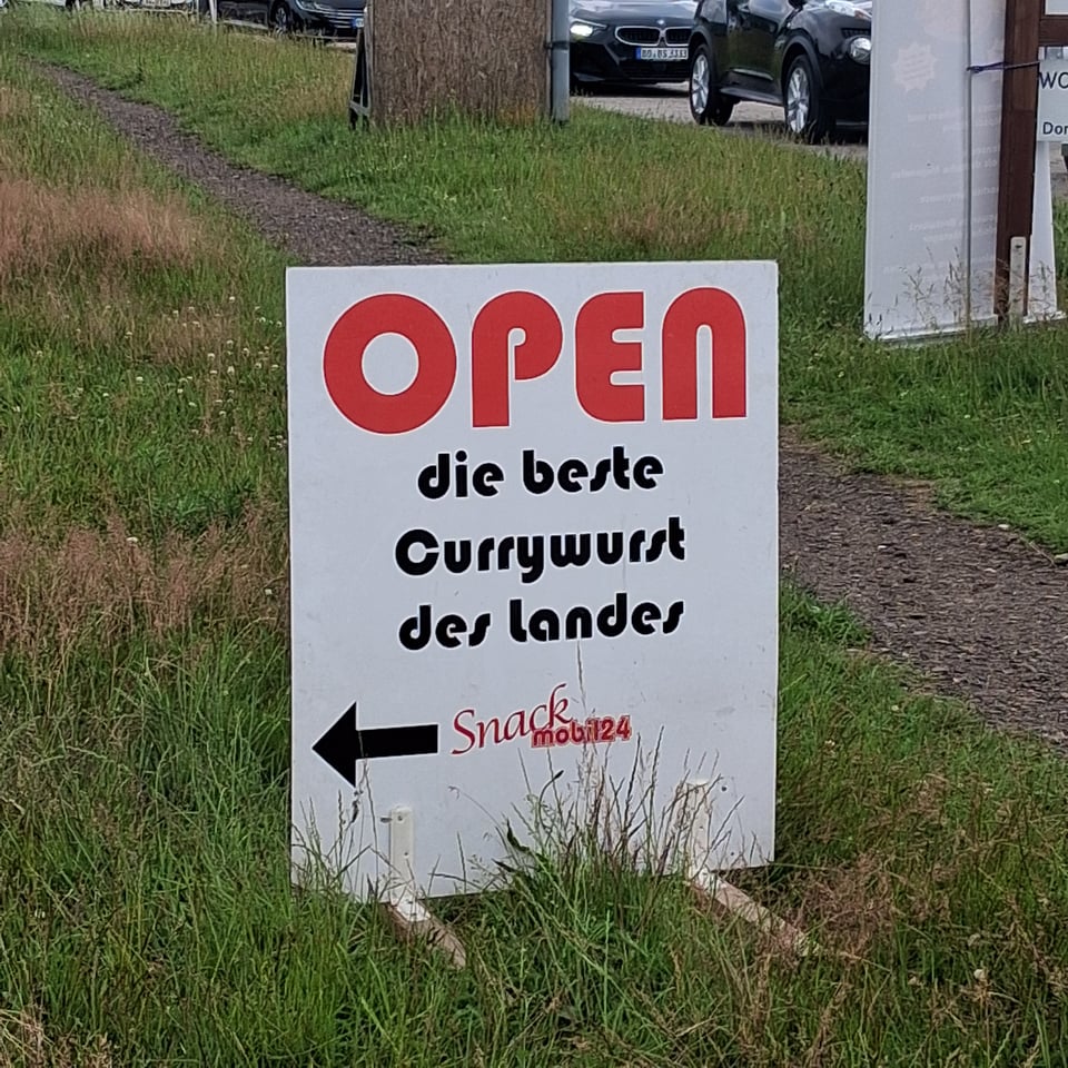 A signing advertising, in German, the best currywurst