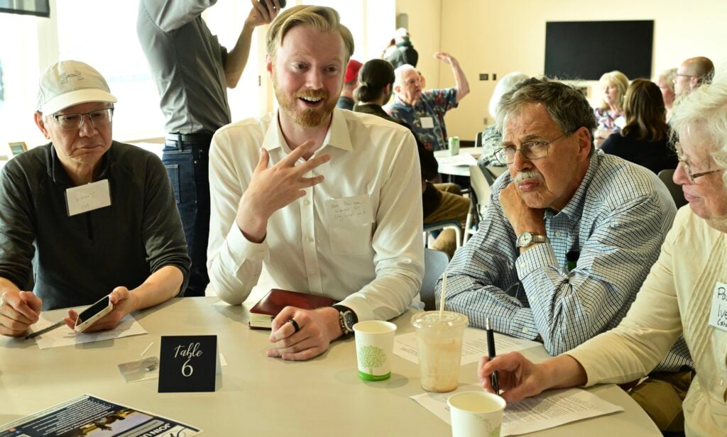 Alex Newman (second from right), candidate for Edmonds City Council #3, talks to voters, including Ross Dimmock (third from right), recently appointed as an at-large Edmonds Port Commissioner, at the Edmonds Civic Roundtable’s candidate speed-dating event on Monday, June 3rd. Photo credit: Julia Wiese, My Edmonds News