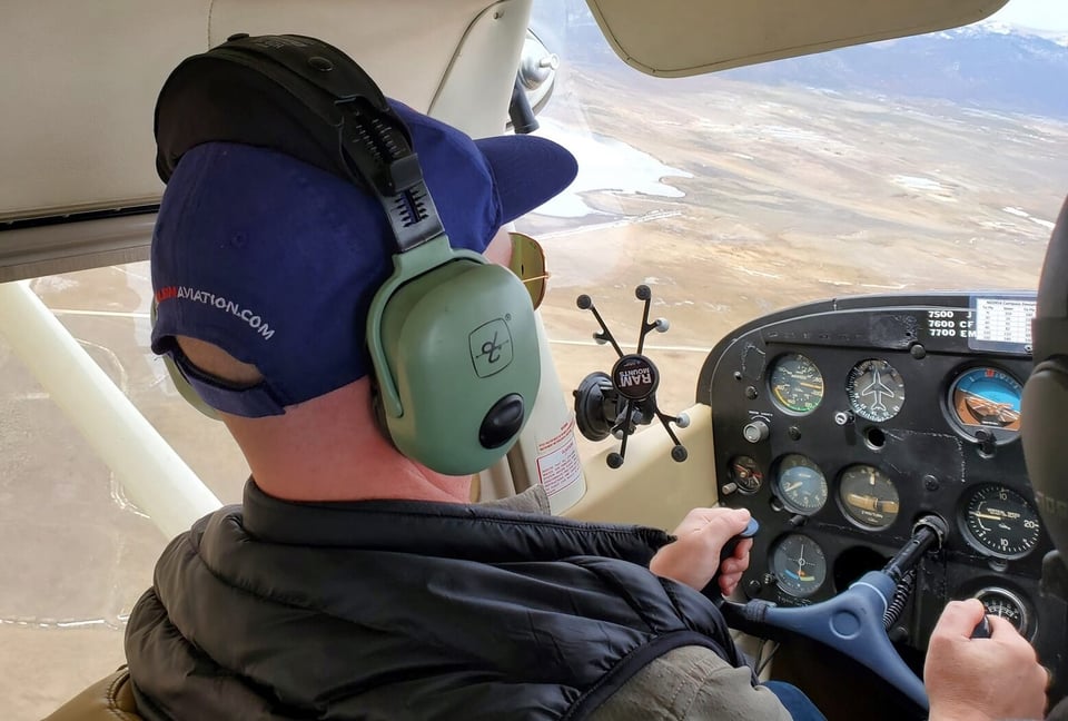 Sam Rogers flying small plane