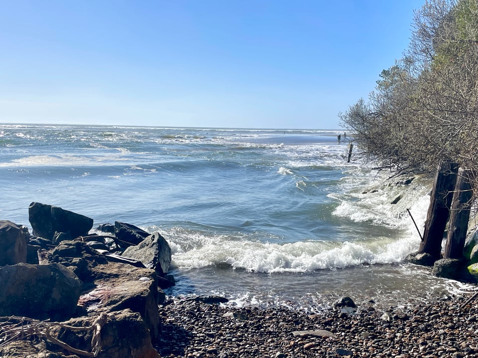 The Pacific Ocean at Bolinas Beach comes high up to the road at high tide
