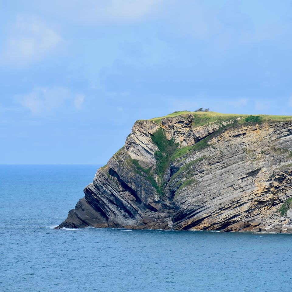 A rocky headland jutting into the ocean.