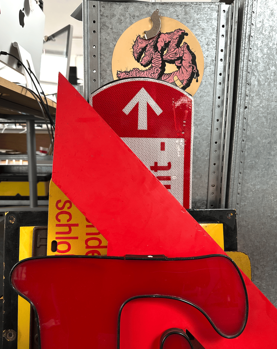 While packing up the studio, all the red and yellow signs posed together. A Coopery E provenance unknown, an Avant-Guarduesque A (old Allstate sign, US), stencilled Berlin-DDR bus replacement sign, enamel Gas line warning (Dutch) and a Dutch bike path sign with type by Gerard Unger. On top: a gutsy House 33 mousepad.