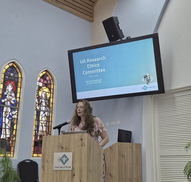 Esther opening the kick off of the UA Research Ethics Application/Committee meeting. She is standing in front of the MC Chapel at the University of Aruba.
