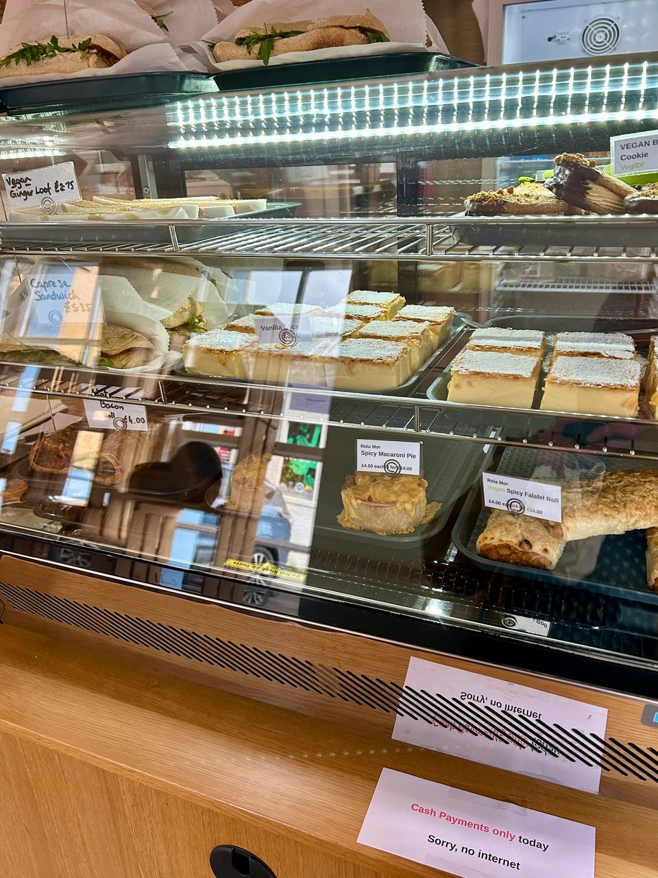 The glass covered counter in The Fat Batard, showing sweet and savoury treats. Image by Rowan Ambrose.