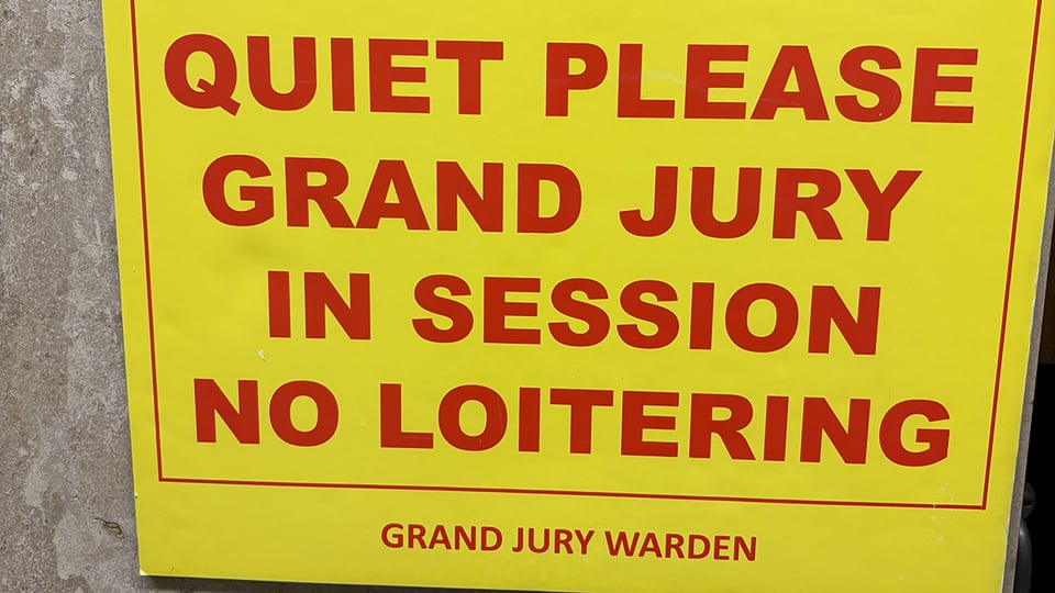 Yellow sign with red lettering posted on the door leading to a Grand Jury room in Manhattan:

QUIET PLEASE
GRAND JURY IN SESSION
NO LOITERING
Grand Jury Warden