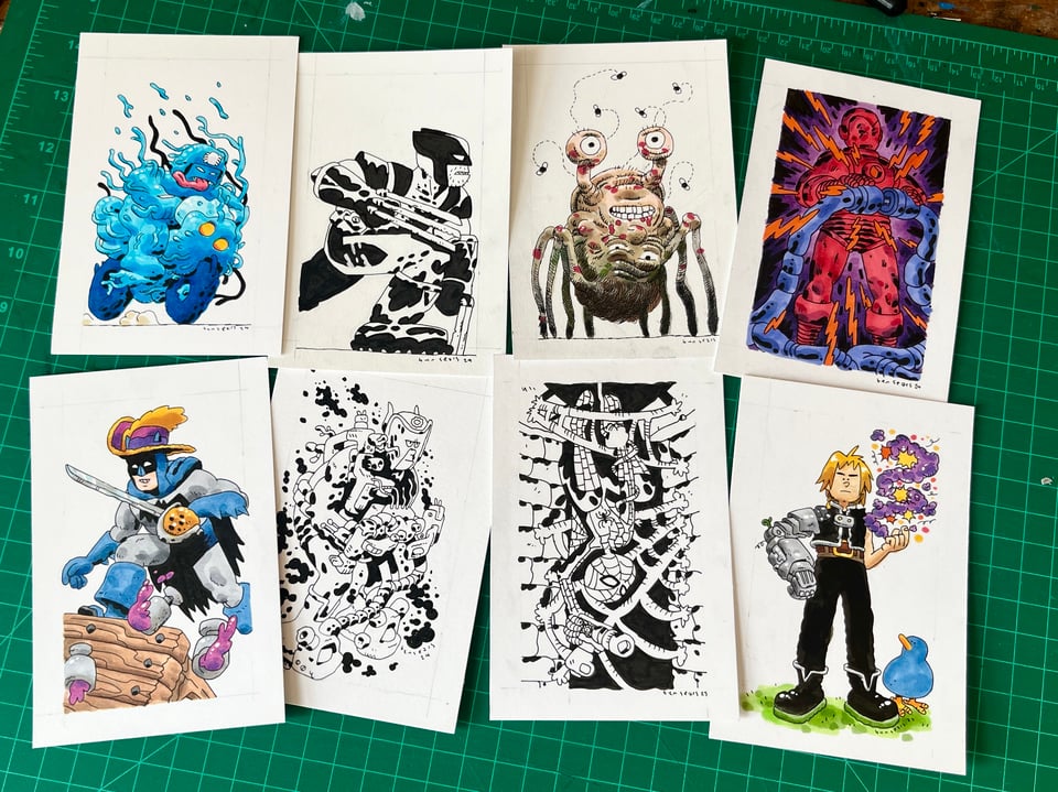 a picture of a stack of original drawings on a desk