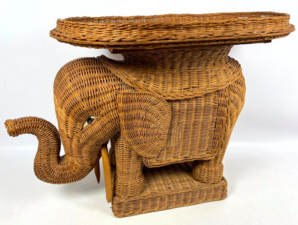 a wicker side table shaped like an elephant