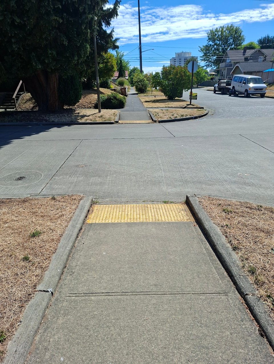 New curb cut with rumble strips for the visually impaired in mom's neighborhood.