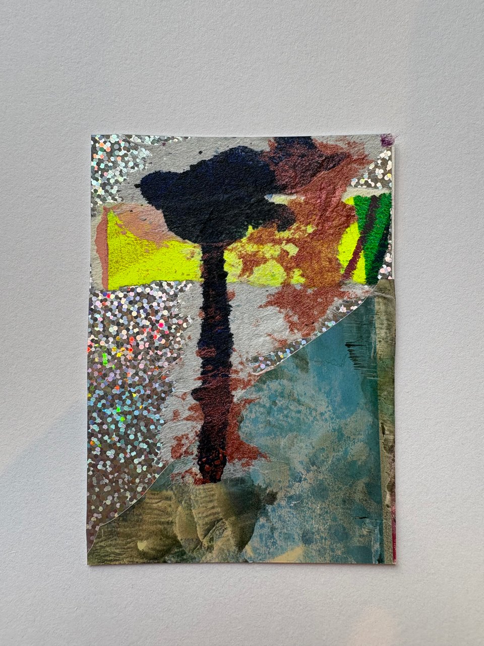 A small piece of collage art by Anna Schmunk that includes some iridescent paper