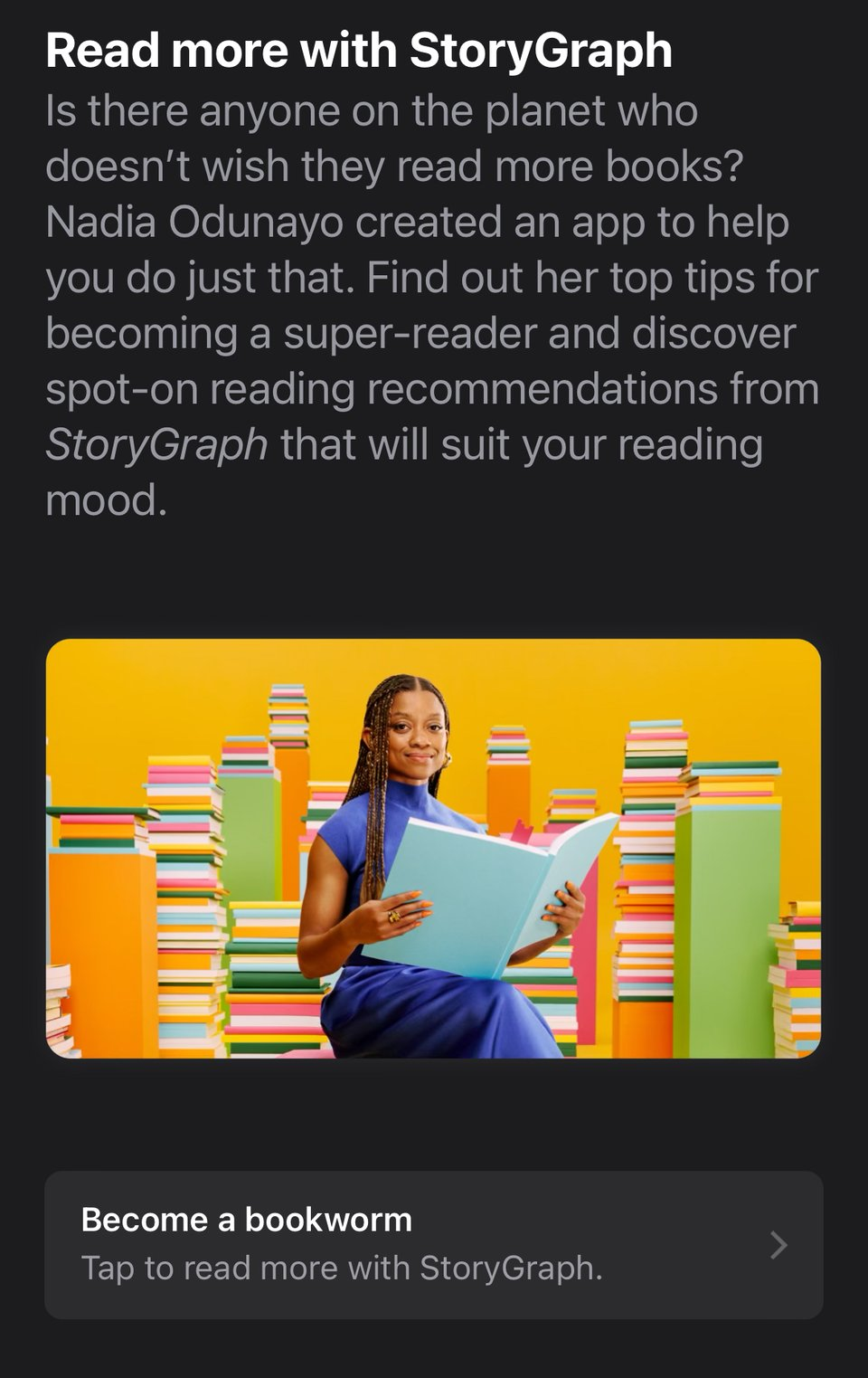 I'm pictured sitting against a colorful backdrop of towering stacks of books, smiling while reading a large blue book. I'm wearing a blue dress, and the setting is vibrant and playful. This promotional image highlights my creation, StoryGraph, and offers advice on becoming an avid reader, with personalized recommendations to match any reading mood.