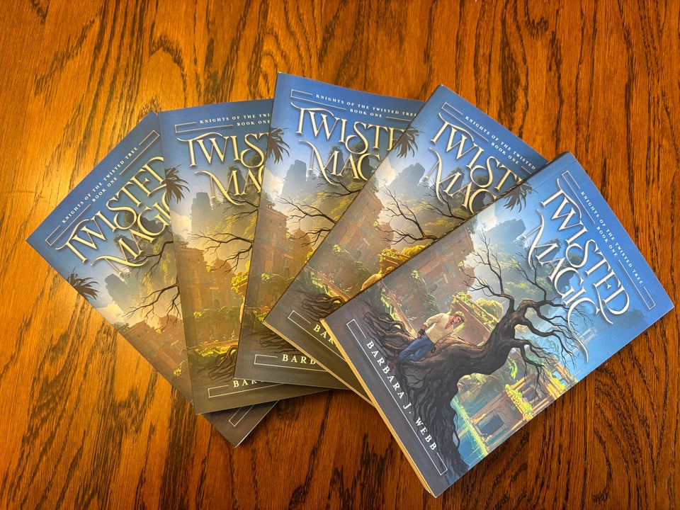 Twisted Magic printed copies fanned across a table.