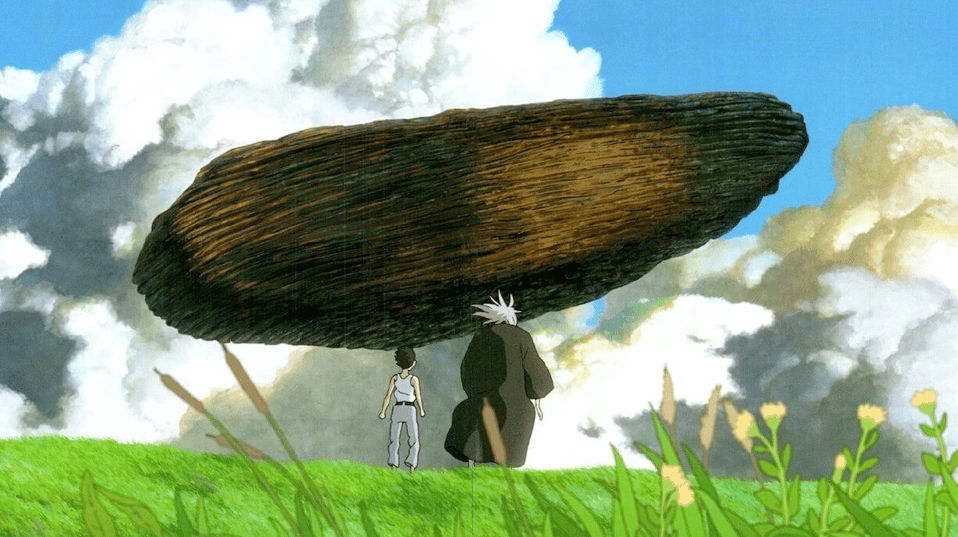 A boy, Mahito, and his grandfather (both seen from behind) examining a large menhir that floats in the air before them