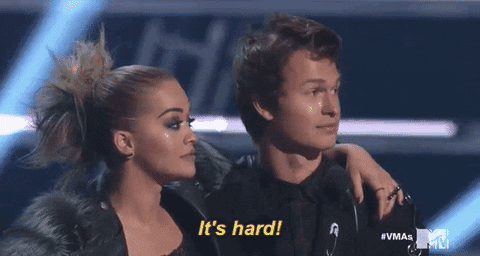 gif of a girl with her arm around a boy saying it's hard