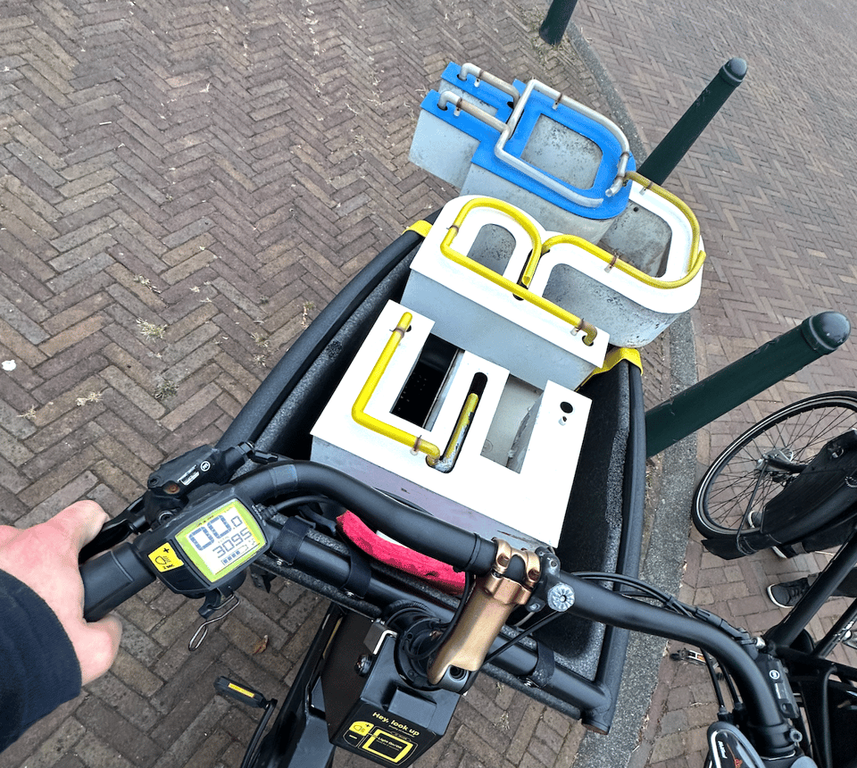 Photo of a partial neon sign in an electric cargo bike.