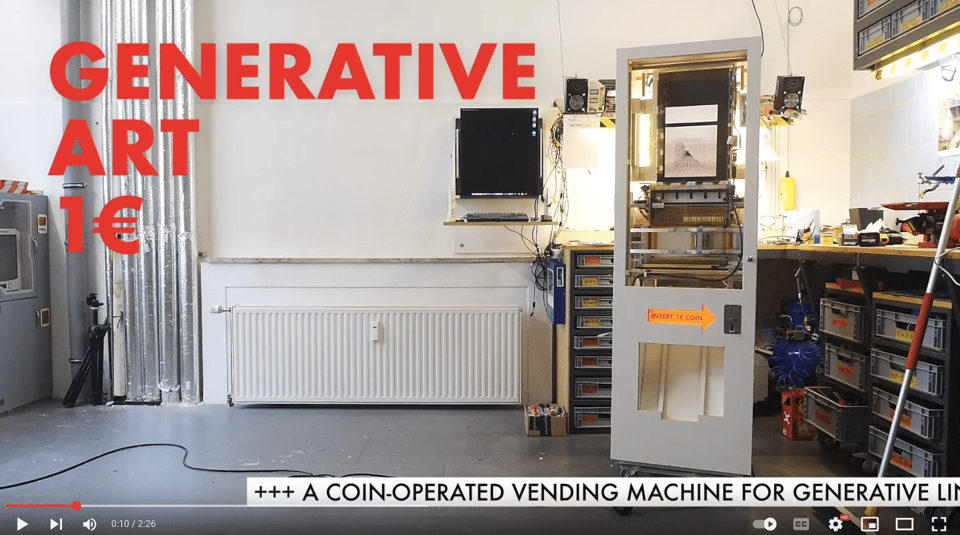 A screenshot of a Youtube video: A coin-operated vending machine for generative art stands in the center of a tidy workshop, surrounded by tools, shelves, and electronic equipment. Bold red text on the left reads “GENERATIVE ART 1€” while a printed arrow on the machine points to a coin slot labeled “INSERT 1€ COIN.” Above the slot, a framed generative line drawing is visible, suggesting the kind of art dispensed. The machine appears custom-built, blending retro vending aesthetics with modern fabrication. A caption at the bottom of the screen reads, “+++ A COIN-OPERATED VENDING MACHINE FOR GENERATIVE LIN,” hinting at the video’s theme.