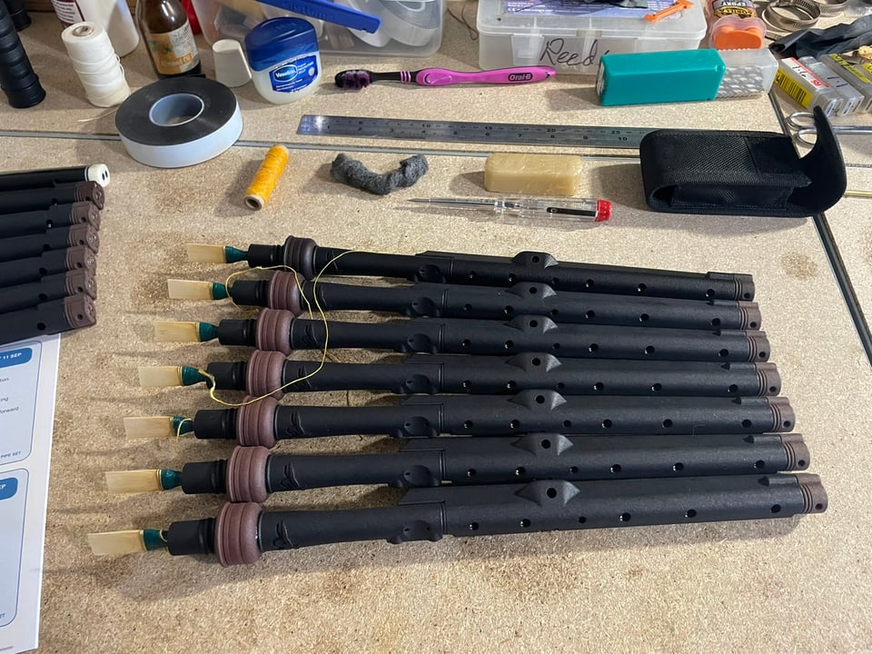 Lindsay System Scottish smallpipes with a teal tweed bag cover