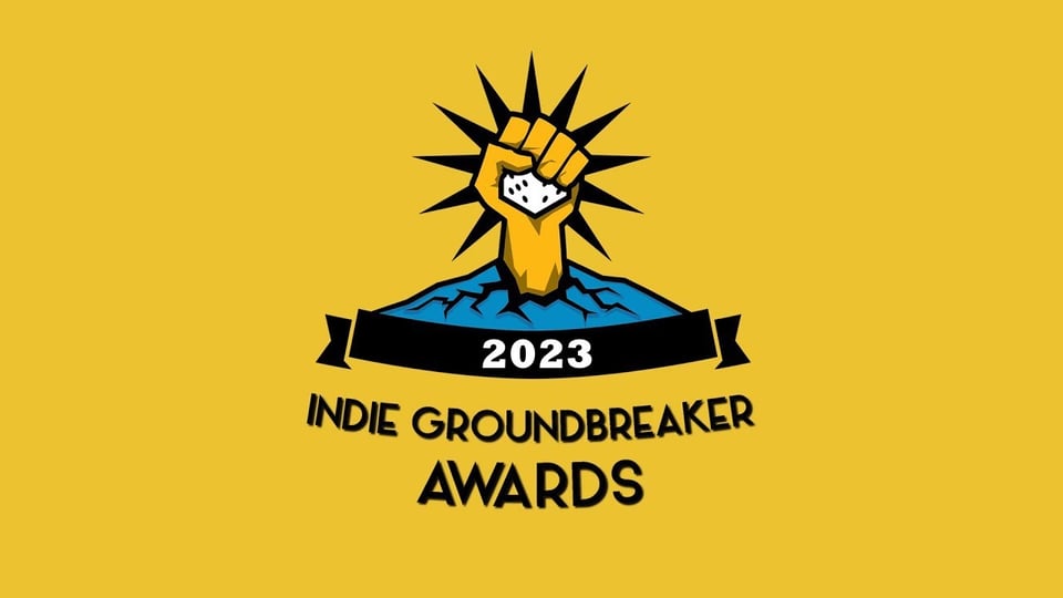 The Indie Groundbreaker Awards logo, featuring a fist rising out of the ground holding a six-sided die. Hilariously it says 2023.