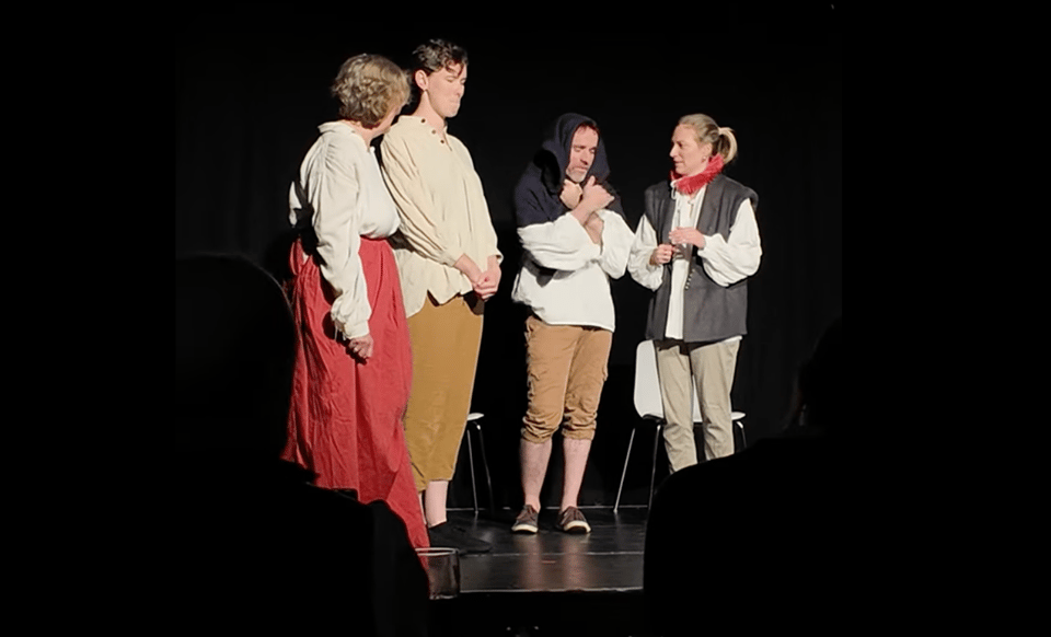 the impromtu shakespeare company performing on a stage