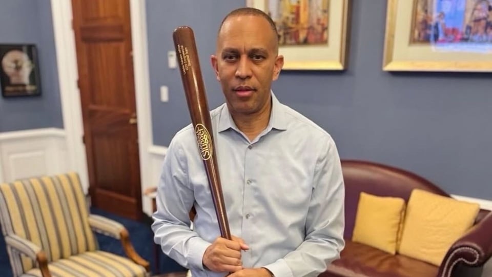 House minority leader Hakeem Jeffries holding a baseball bat to project toughness after Trump's Big Ugly Bill passed