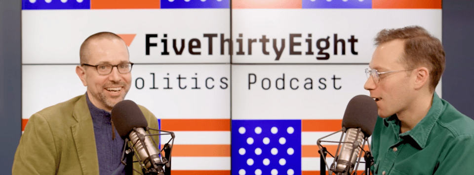 Dan Bouk has something of a delighted look as Galen Druke asks a question, his hand slightly raised for emphasis