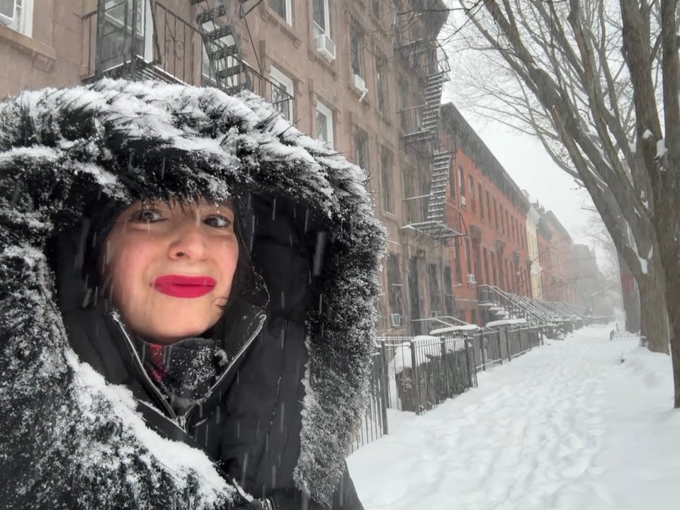 A flush-faced in the snow with Revlon Cherries in the Snow lipstick, Brooklyn, New York, January 2026