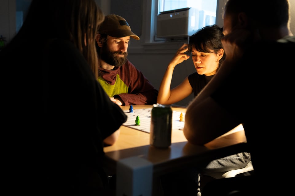 People playing a board game.