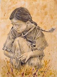 A young Apache girl rests in the grass, she's in authentic dress, circa 1870s