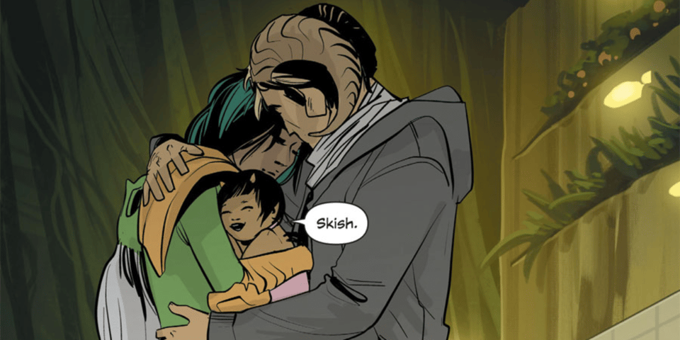 A space family share a hug.