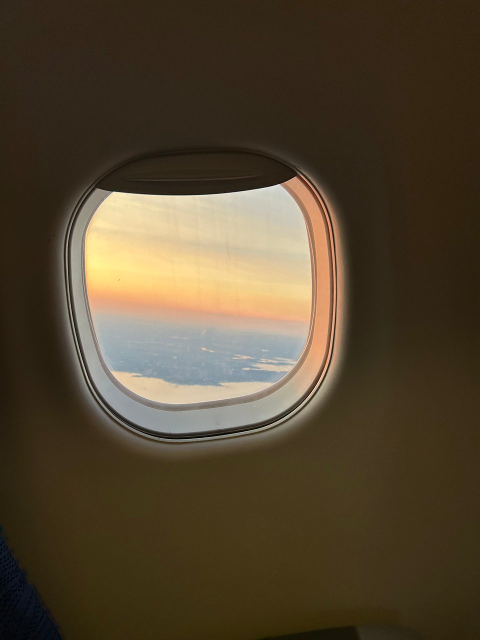 Photo of the view out of an airplane window, somewhere over Boston.