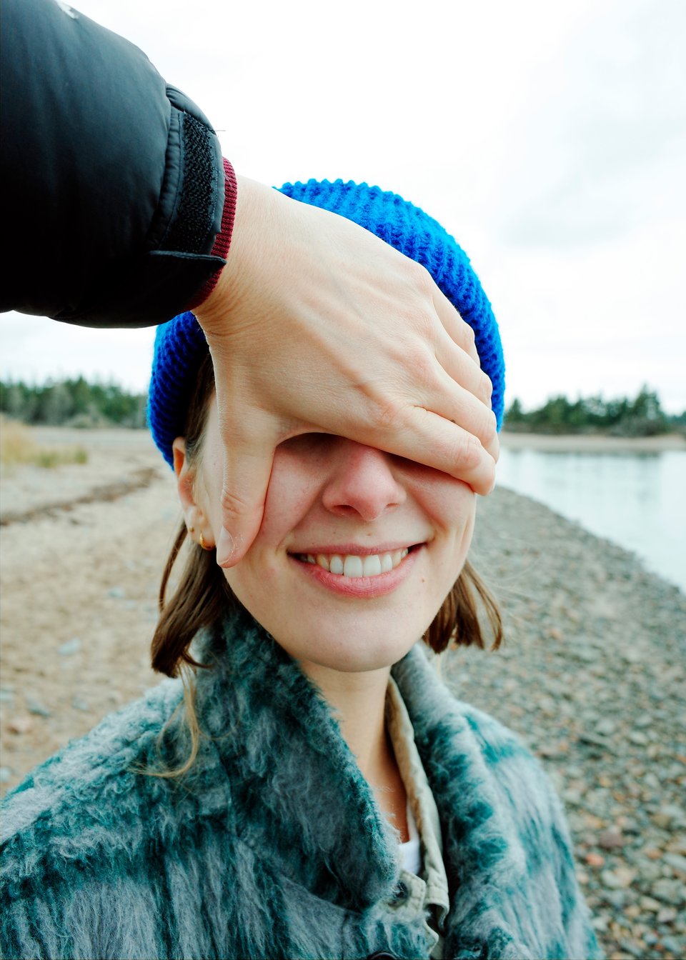 A picture of Sophie's face with Mo's hand covering their eyes
