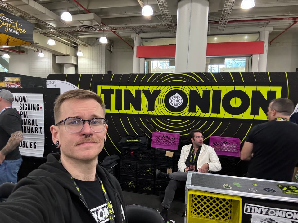 Me and Some Guy at the Tiny Onion Booth
