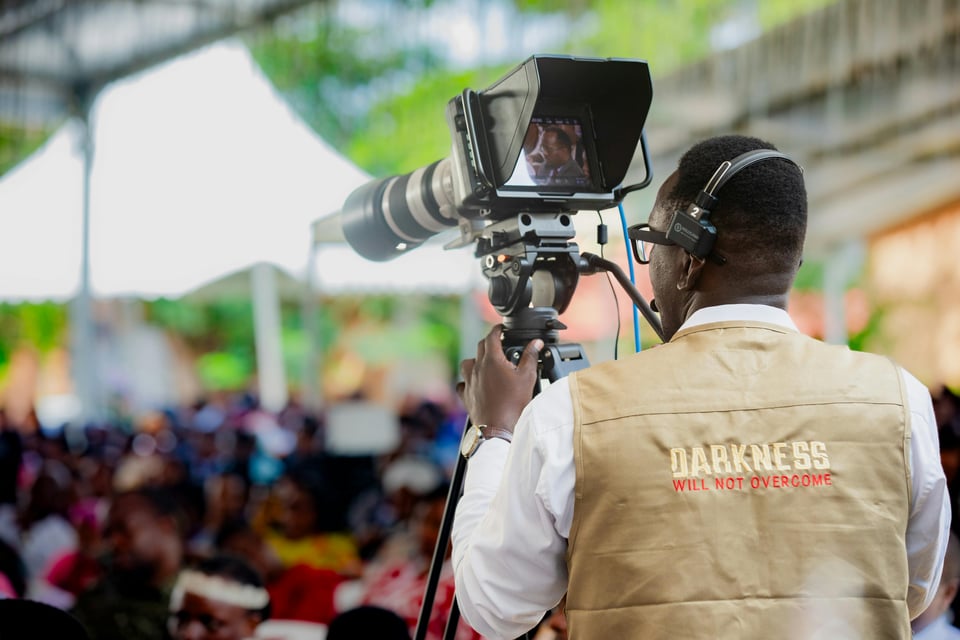 Photo of a cameraman taken by Jeff Kweba