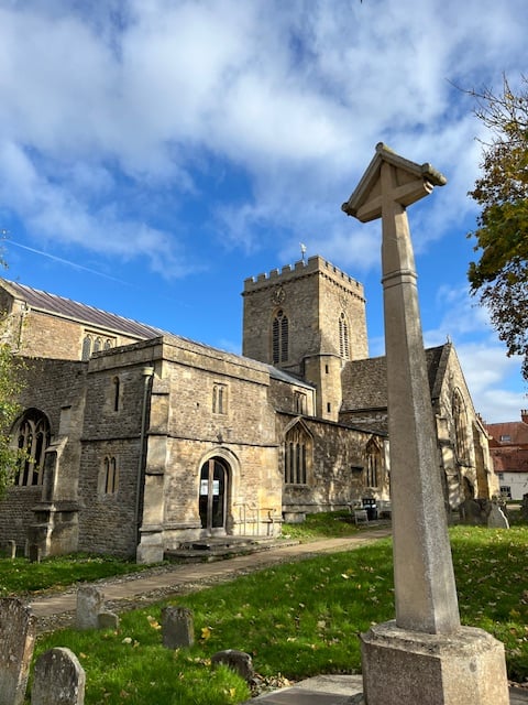 A lovely small church, seen from the graveyard, its foundations Norman
