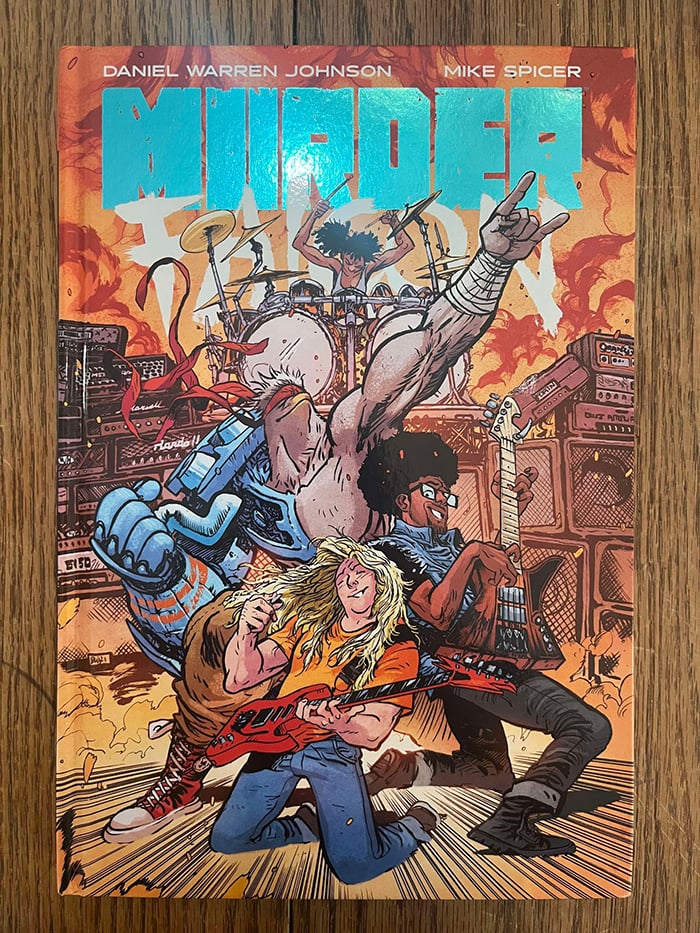 The cover to the graphic novel Murder Falcon, featuring a band and a cyborg falcon man rocking out