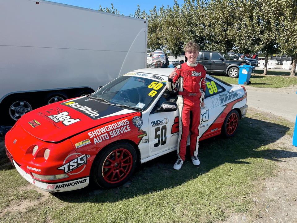 Alex Sprague in front of his 2kcup car