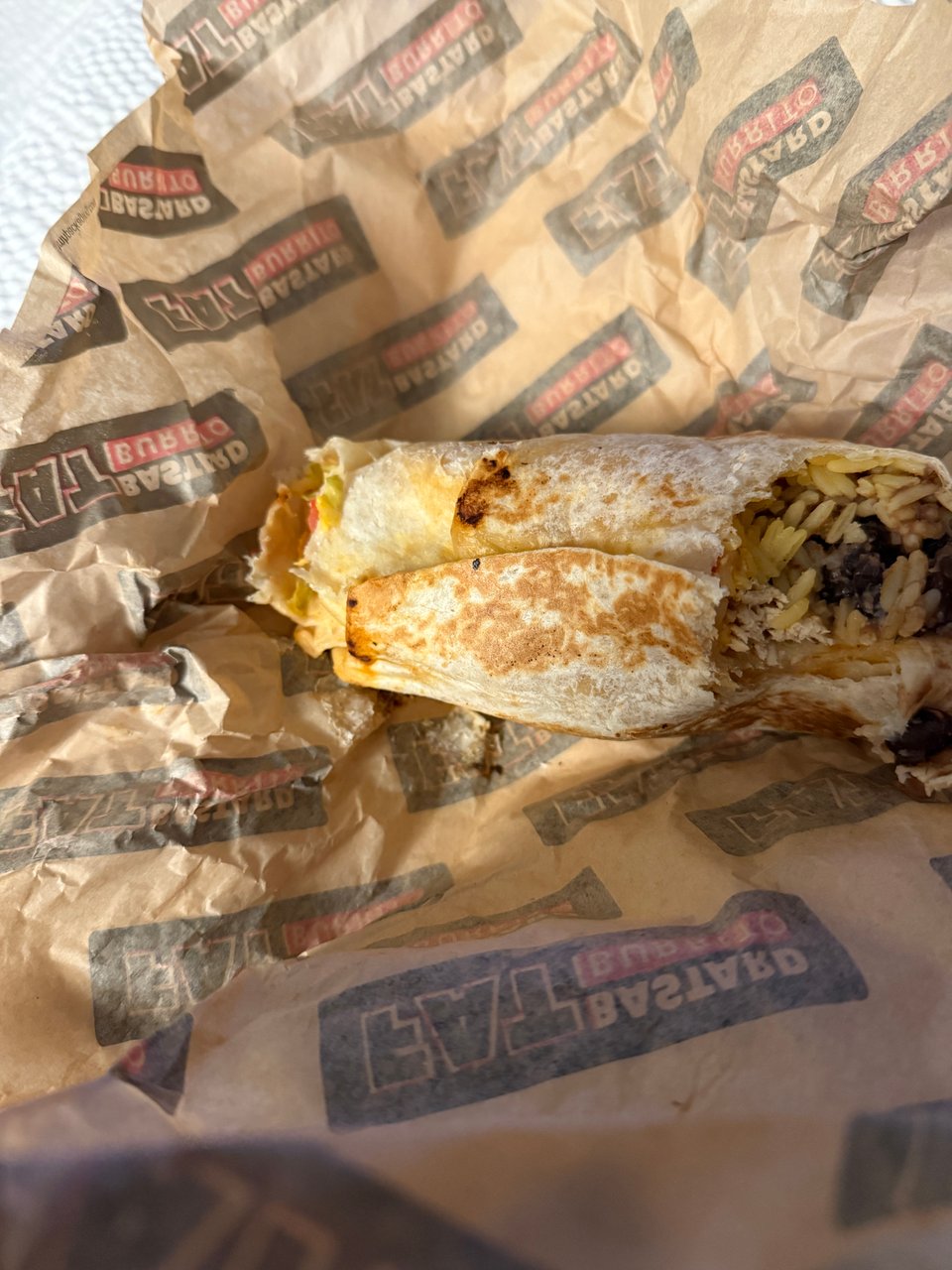 a burrito with one bite taken out of it