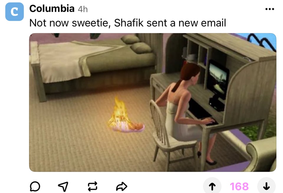a woman sitting in front of a fireplace