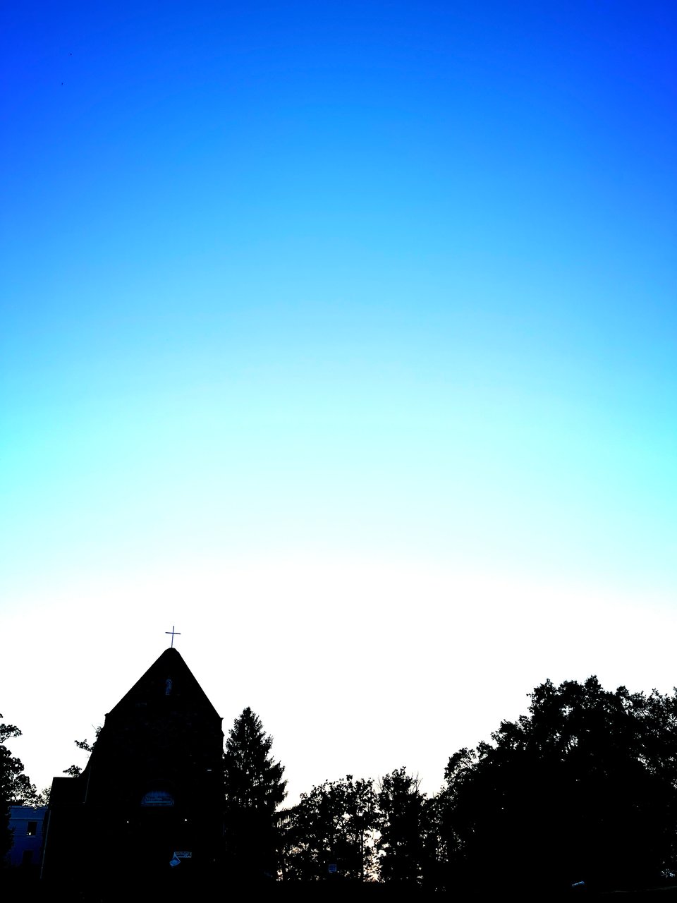 A church silhouette at sunset.