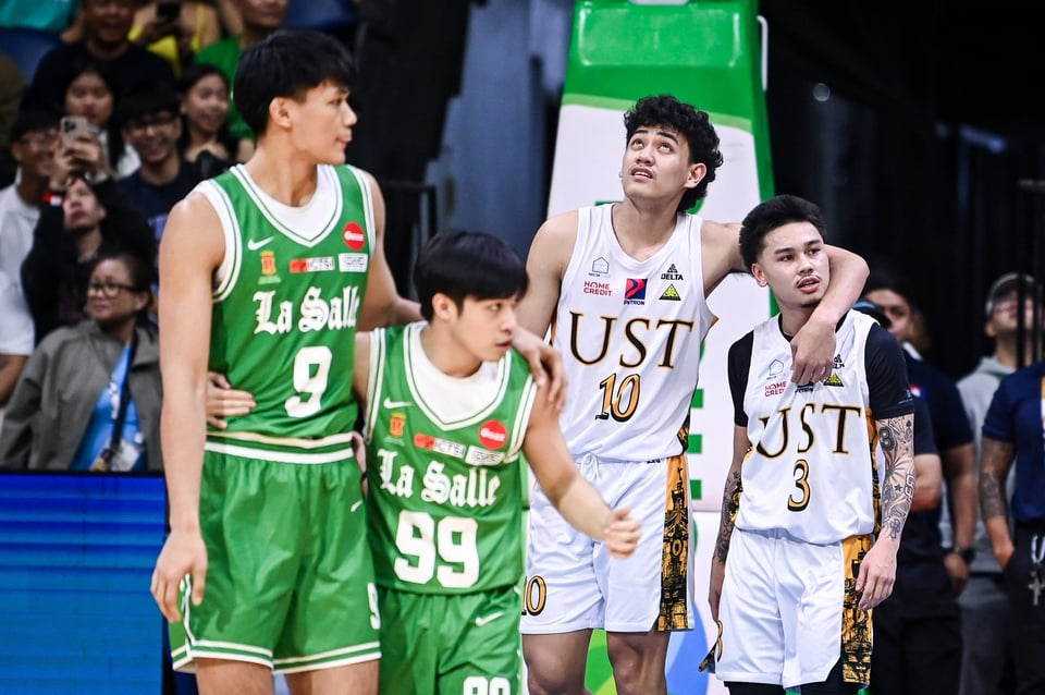 two pairs of filipino basketball players stand, arms wrapped around each other. in each pair, one is much shorter than the other.