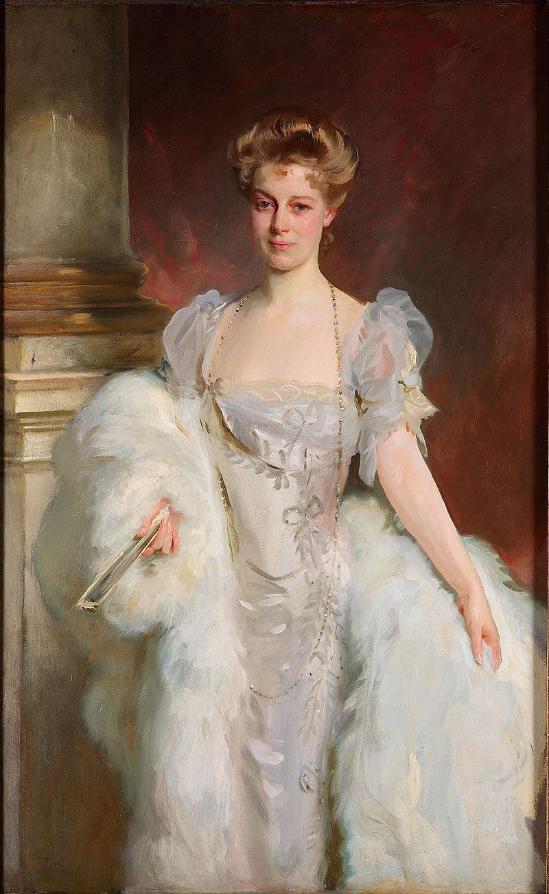 A portrait of a white woman in a white gown, described below in the newsletter. She stands in front of a massive white marble pillar and a reddish brown wall.