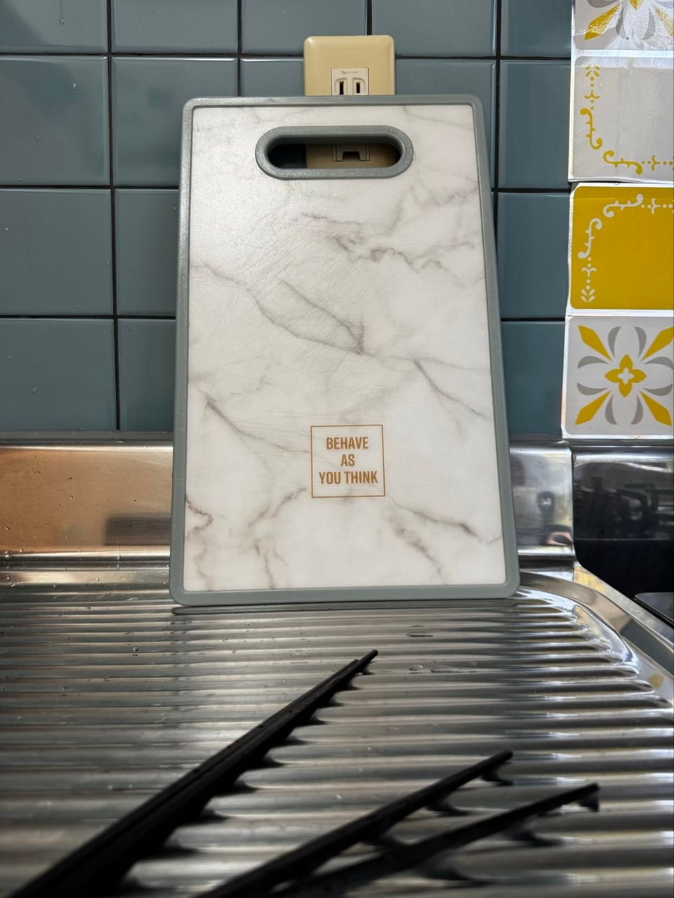 a cutting board with the words "behave as you think" printed on it