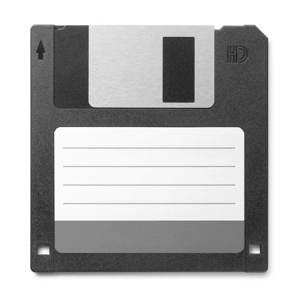 [A black high density floppy disk with a white sticker for labelling.]