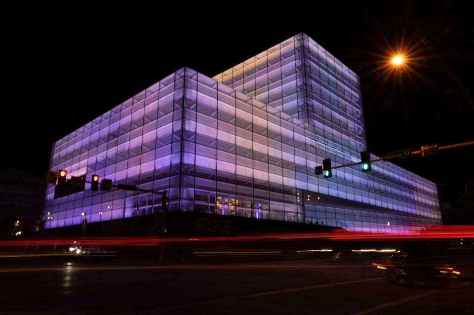 The Figge Art Museum glows under the new permanent light installation, Evanescent Field by Leo Villareal, the largest public art piece in Iowa, as blurred traffic streaks by on Saturday, May 17