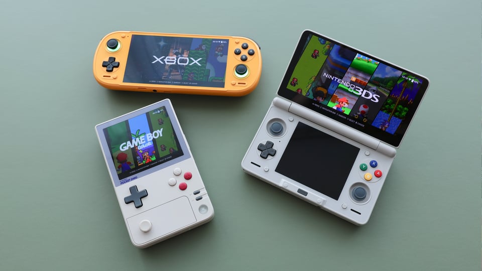 Retroid Pocket 6, AYN Thor, and AYANEO Pocket DMG, all running ROCKNIX