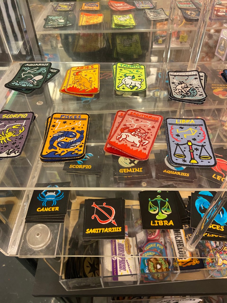 a display of star sign patches